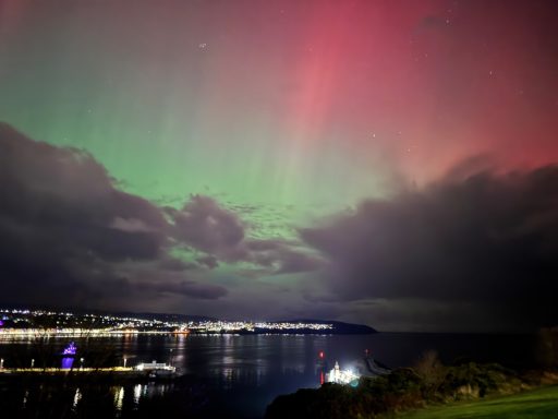 Looking out to sea at the northern lights, Isle of Man