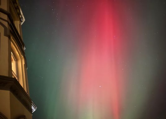 The reds and greens of the aurora over Endfield House, Port St Mary, Isle of Man